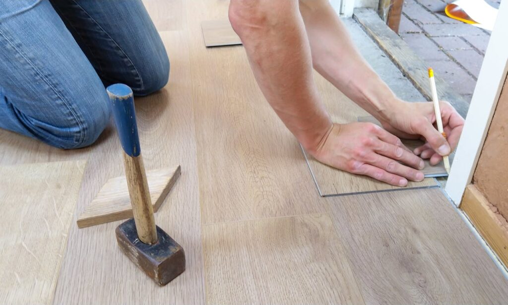 Fix-and-Flip Loans: The Complete Guide 1 A contractor, who has been hired by a real estate investor with a fix-and-flip loan, is installing new floors.