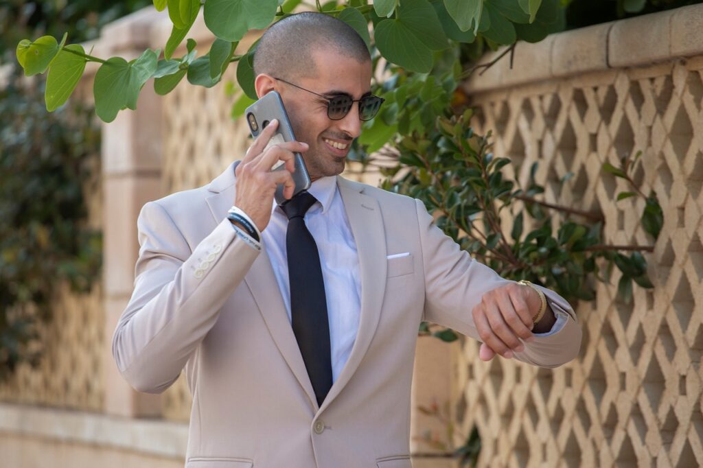 Jumbo Loans: The Complete Guide 2 A successful man in a suit is on the phone, making a phone call to inquire about jumbo loans.