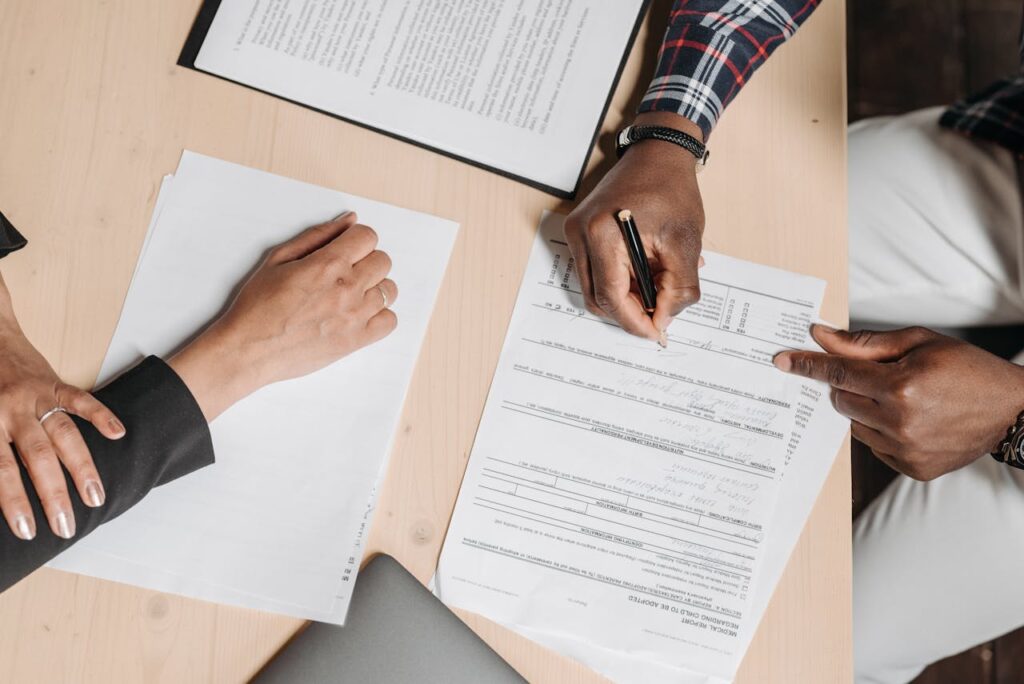 Mortgage Closing Costs: The Complete Guide 1 A new homeowner is signing the paperwork and paying mortgage closing costs to close the deal.