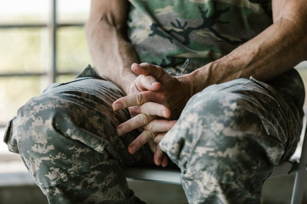 Interest Rate Cuts: Refinancing, Rates and What You Need to Know 3 An active-duty military individual is holding his hands anxiously while waiting for interest rate cuts.