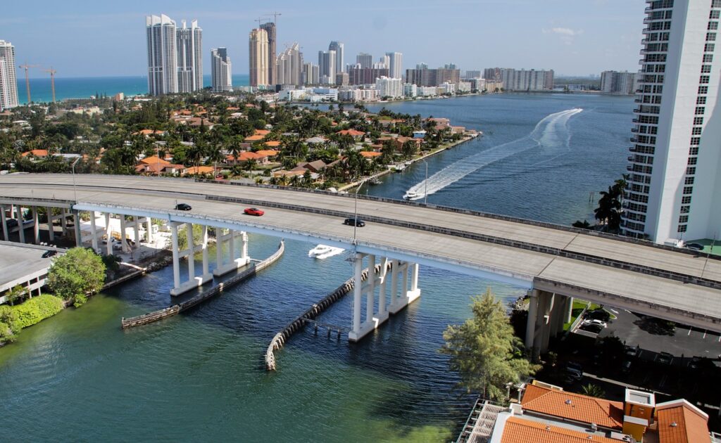 Conventional Loan Florida: What Homebuyers Need to Know 1 A bridge in Miami with the skyline in the background, which is a beautiful and scenic place to buy a home and finance it with a conventional loan Florida.