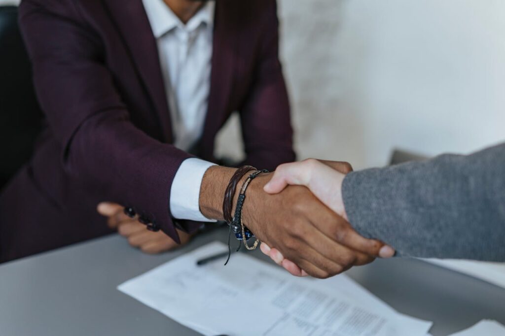 Construction Loan Texas: A Guide to Building Your Dream Home 3 A loan officer shaking a client's hand while closing the deal on a construction loan Texas.