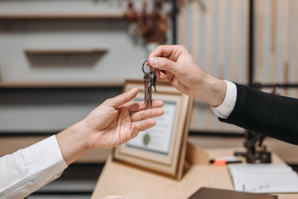 DSCR Loan New Hampshire Guide: Real Estate Investing Made Simple 2 A landlord who financed his property with a DSCR loan New Hampshire is handing over the keys to a new tenant.
