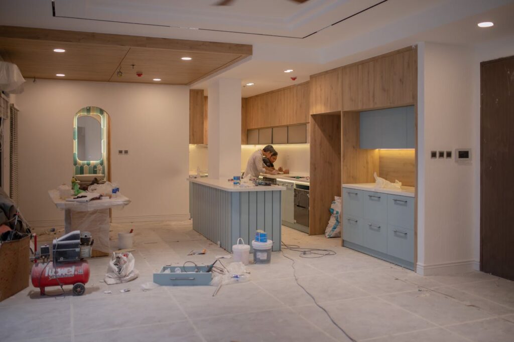 DSCR Loan Washington: Maximize ROI With Flexible Financing 5 Two people are renovating a kitchen with a fix-and-flip loan, which is an alternative to a DSCR loan Washington for real estate investors.