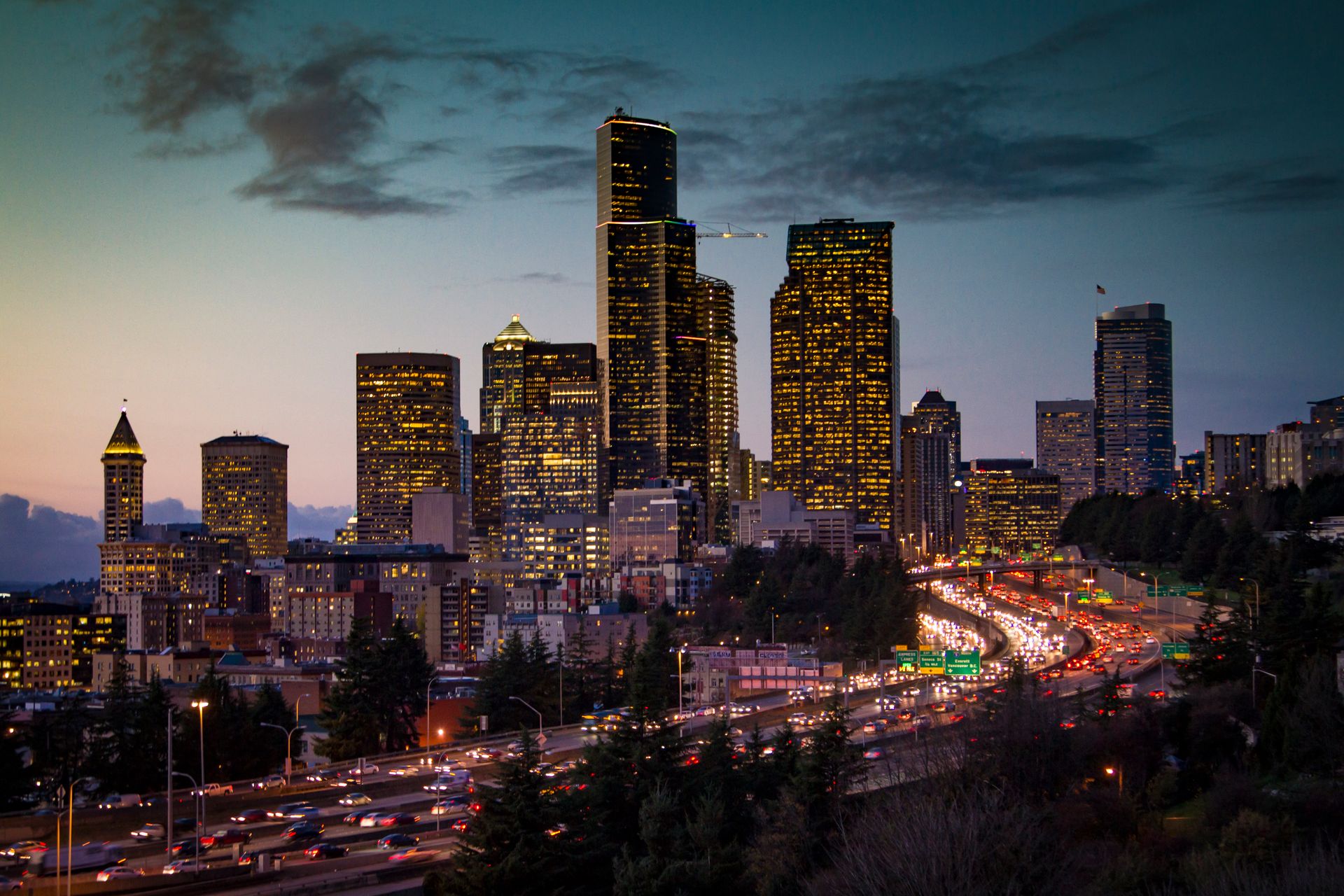 The Digital Deed 30 Seattle skyline at twilight with city lights
